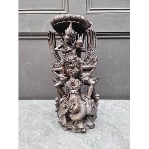 1274 - A Balinese carved hardwood sculpture, 42cm high. 