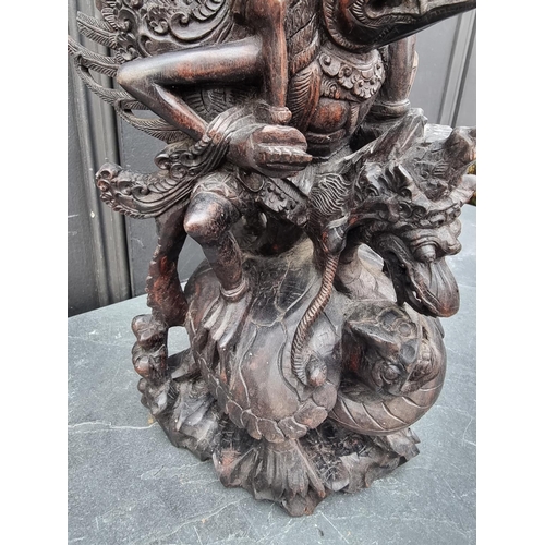 1274 - A Balinese carved hardwood sculpture, 42cm high. 