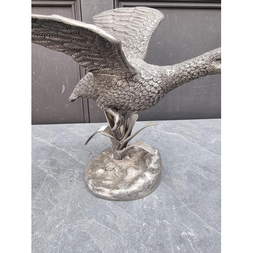 1275 - A pewter flying goose, 34cm high. 