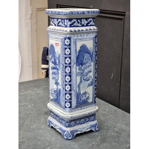 1277 - A Chinese blue and white vase and stand, 42cm high.