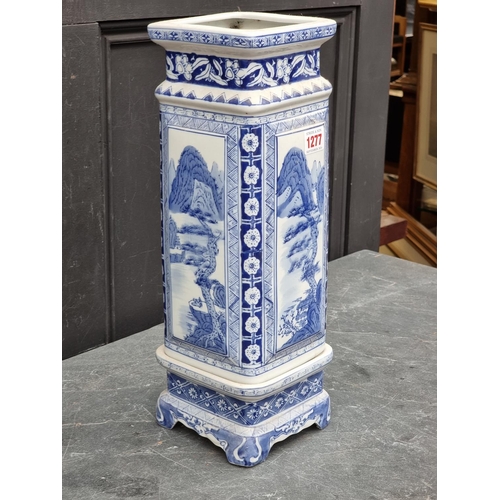 1277 - A Chinese blue and white vase and stand, 42cm high.