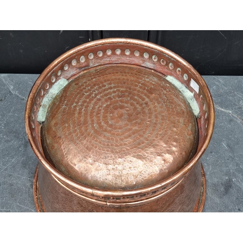 1278 - A hammered copper jardiniere, 25.5cm high x 33.5cm diameter.