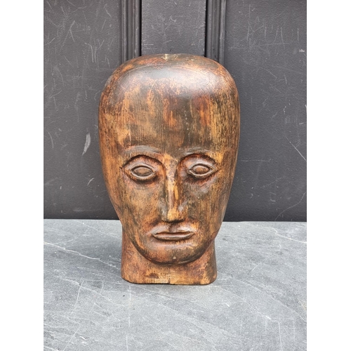 1279 - An unusual carved softwood head, 28cm high.