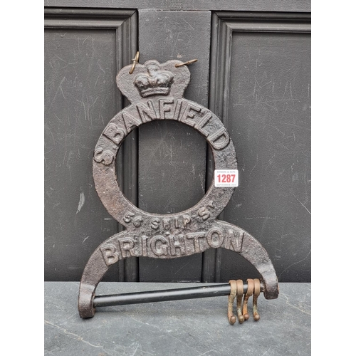 1287 - Advertising: a Victorian cast iron hook or bracket, inscribed 'S Banfield, 56 Ship St, Brighton', 27... 