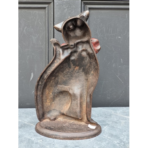 1300 - An antique cast iron Cat doorstop, with glass eyes, 37cm high.