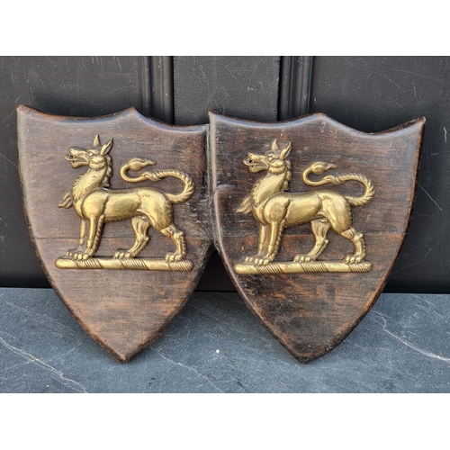 1301 - An old oak conjoined shield plaque, mounted with two heraldic tigers, 36.5cm wide.