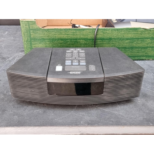 1303 - Hi-Fi Equipment: a Bose Wave Radio/CD player, model AWRC3G, with remote control; and another radio. ... 