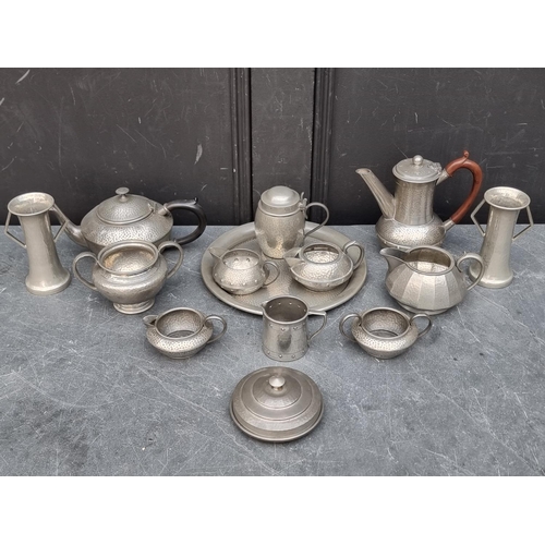 1307 - A small collection of hammered pewter teawares and similar. 