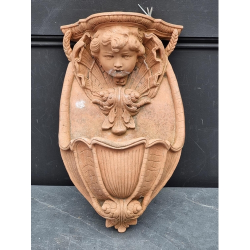 1315 - A terracotta wall fountain, 47cm high.  