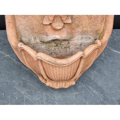 1315 - A terracotta wall fountain, 47cm high.  