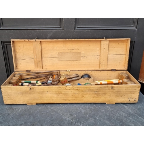 1322 - An antique croquet set, boxed.