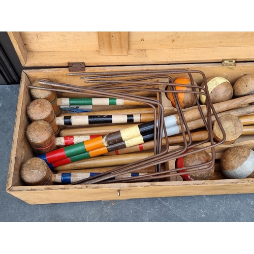 1322 - An antique croquet set, boxed.