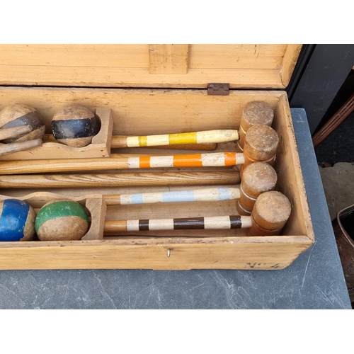 1322 - An antique croquet set, boxed.