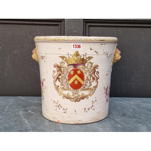 1336 - A 19th century French pottery armorial wine cooler, 29.5cm high x 32cm diameter, (a.f.).... 