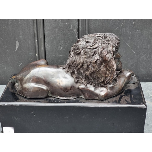 1337 - A bronze recumbent Lion, in the manner of Antonio Canova, on ebonized base, 32.5cm wide.... 