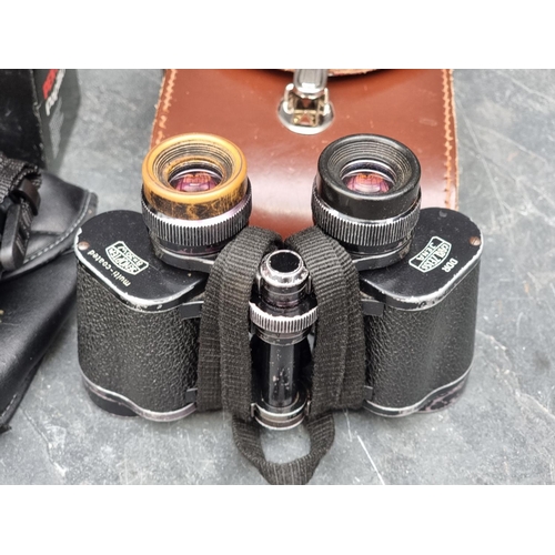 1340 - Three cased pairs of binoculars, to include a pair of Carl Zeiss 'Jenoptem 8x30W examples.... 