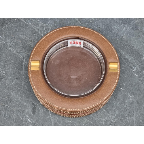 1352 - A Gucci leather ashtray, 18cm diameter. 