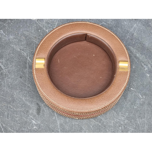 1352 - A Gucci leather ashtray, 18cm diameter. 