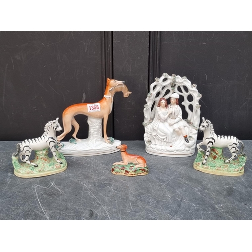 1358 - A rare pair of Victorian Staffordshire pottery Zebras, 12.5cm high; together with two Staffordshire ... 