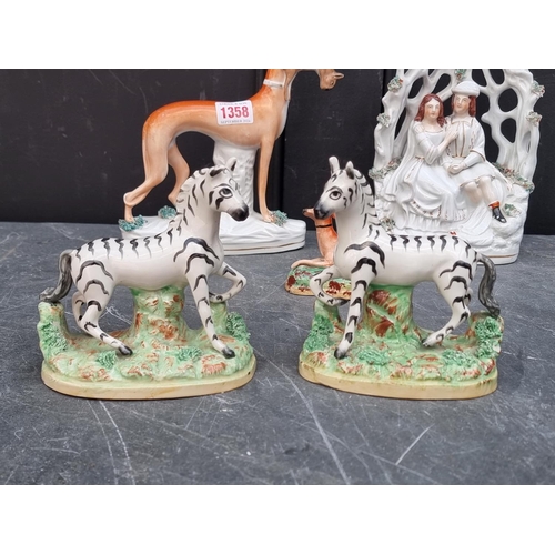 1358 - A rare pair of Victorian Staffordshire pottery Zebras, 12.5cm high; together with two Staffordshire ... 