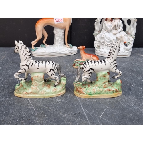 1358 - A rare pair of Victorian Staffordshire pottery Zebras, 12.5cm high; together with two Staffordshire ... 