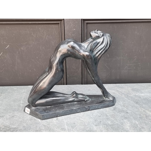 1366 - After Alexander Danel, a pottery sculpture of a kneeling nude, by Austin Reproductions, 46cm wide.... 