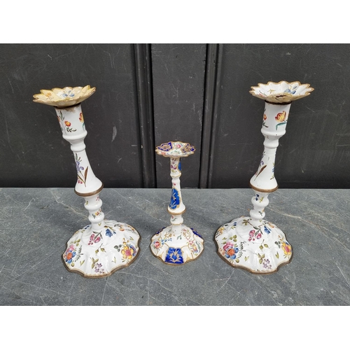 1383 - A scarce pair of 18th century Bilston or Battersea enamel candlesticks, 25.5cm high; together with a... 