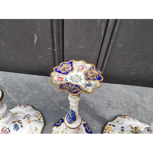 1383 - A scarce pair of 18th century Bilston or Battersea enamel candlesticks, 25.5cm high; together with a... 