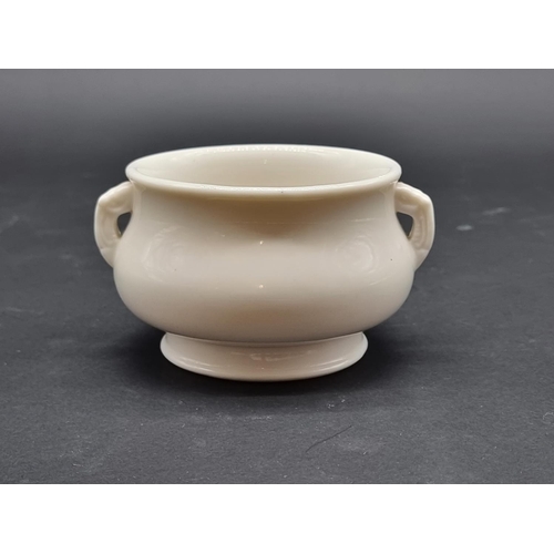 1389 - A Chinese blanc de chine twin handled censer, indistinct pressed seal mark to base, 13cm wide.... 