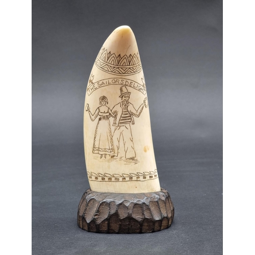 1393 - Taxidermy: a Scrimshaw carved Whale's tooth, inscribed 'The Sailors Delight', on oak base, 16.5cm hi... 