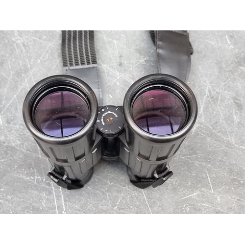 1408 - A pair of Zeiss 10x40B binoculars, in leather case, with guarantee booklet.