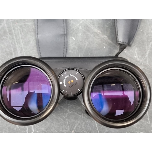 1408 - A pair of Zeiss 10x40B binoculars, in leather case, with guarantee booklet.