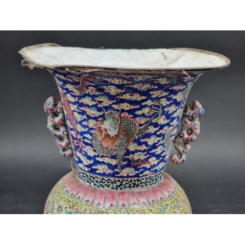 1411 - A Chinese Canton enamel twin handled vase and stand, 18th century, 28cm high, (a.f.).... 