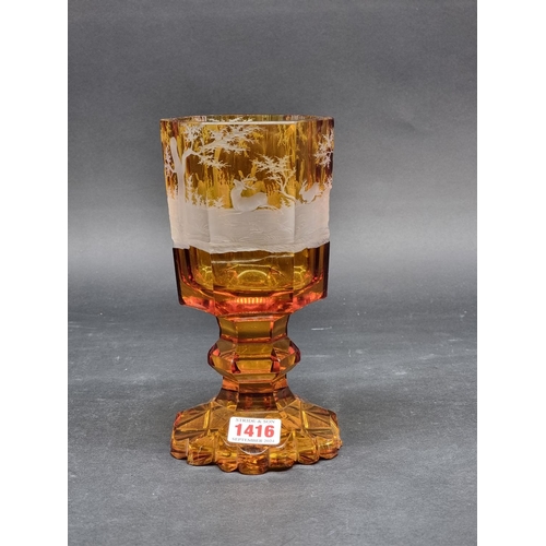 1416 - A 19th century Bohemian amber and cut glass hexagonal goblet, decorated with a continuous stag hunti... 