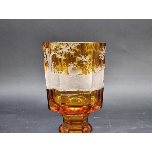 1416 - A 19th century Bohemian amber and cut glass hexagonal goblet, decorated with a continuous stag hunti... 