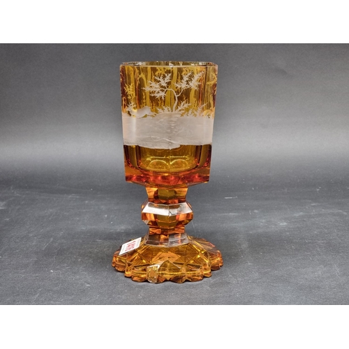 1416 - A 19th century Bohemian amber and cut glass hexagonal goblet, decorated with a continuous stag hunti... 