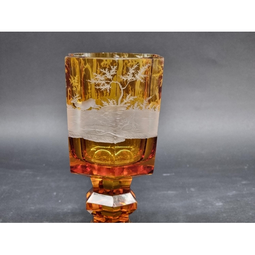 1416 - A 19th century Bohemian amber and cut glass hexagonal goblet, decorated with a continuous stag hunti... 