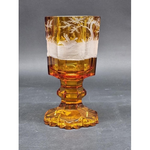 1416 - A 19th century Bohemian amber and cut glass hexagonal goblet, decorated with a continuous stag hunti... 