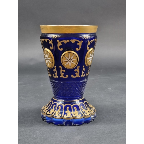 1418 - Four 19th century Bohemian glass beakers, to include a cameo example, largest 18cm high.... 