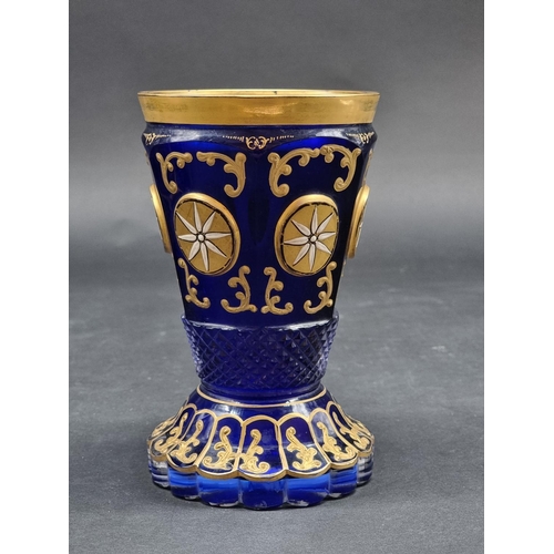 1418 - Four 19th century Bohemian glass beakers, to include a cameo example, largest 18cm high.... 