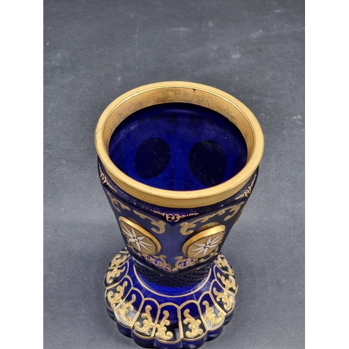 1418 - Four 19th century Bohemian glass beakers, to include a cameo example, largest 18cm high.... 