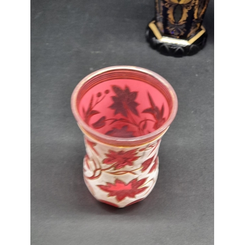 1418 - Four 19th century Bohemian glass beakers, to include a cameo example, largest 18cm high.... 