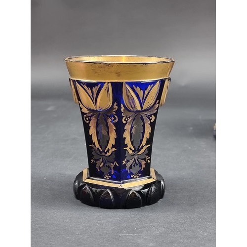 1418 - Four 19th century Bohemian glass beakers, to include a cameo example, largest 18cm high.... 