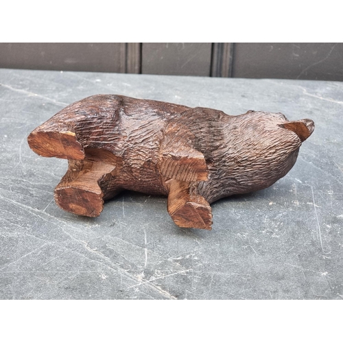 1427 - A Black Forest style carved hardwood bear, 20.5cm long.