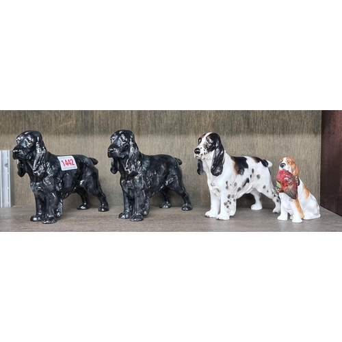 1442 - Four Royal Doulton Spaniels, comprising HN1029; HN1109 and HN1020 (2). (4)