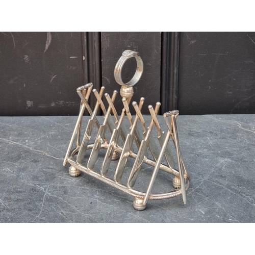 1445 - An electroplated novelty cricket bat and stumps toast rack, 19cm wide.