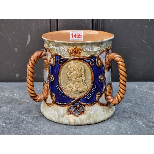 1455 - A Royal Doulton Lord Nelson commemorative tyg, 17cm high, (restoration to one handle).... 