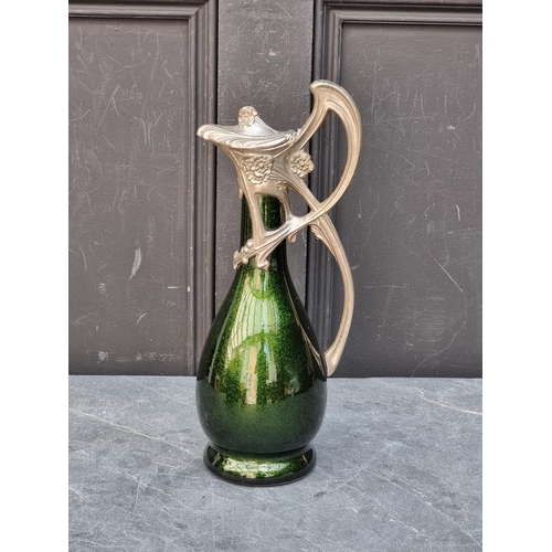 1469 - An Art Nouveau pewter and aventurine glass claret jug, 33.5cm high.