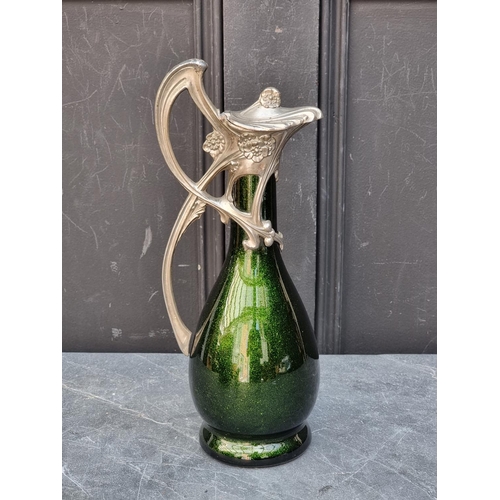 1469 - An Art Nouveau pewter and aventurine glass claret jug, 33.5cm high.