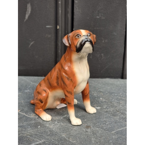 1475 - A Royal Doulton 'The British Bulldog', DA228 (Fawn); together with a John Beswick Boxer dog. (2)... 